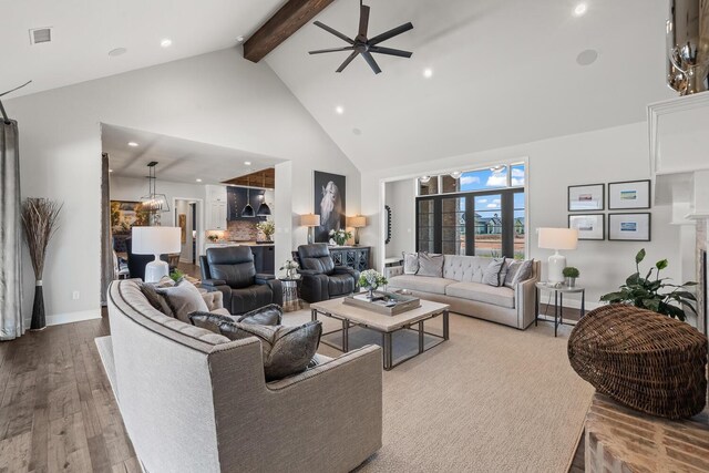 7733 46th St, Lubbock, TX 79407 - living area featuring high vaulted ceiling, beam ceiling, wood finished floors, recessed lighting, and a ceiling fan