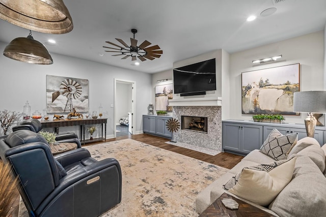 7733 46th St, Lubbock, TX 79407 - living area with ceiling fan, a fireplace with flush hearth, dark wood finished floors, and recessed lighting