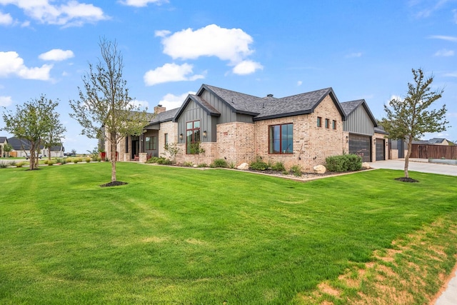 7733 46th St, Lubbock, TX 79407 - view of property exterior featuring board and batten siding, an attached garage, brick siding, and concrete driveway
