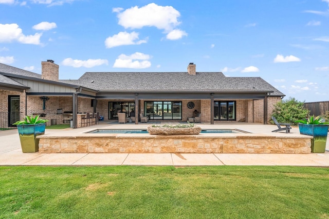 7733 46th St, Lubbock, TX 79407 - view of pool with an in-ground hot tub, a patio, and an outdoor kitchen