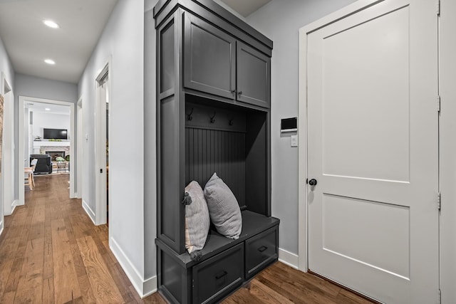 7733 46th St, Lubbock, TX 79407 - mudroom with wood finished floors, recessed lighting, and a fireplace