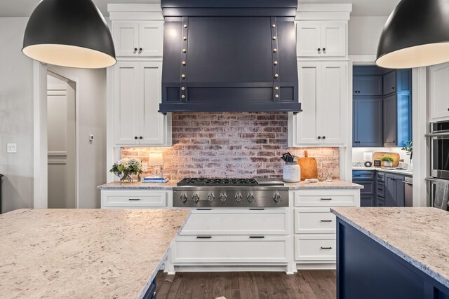 7733 46th St, Lubbock, TX 79407 - kitchen featuring extractor fan, stainless steel gas stovetop, and white cabinets