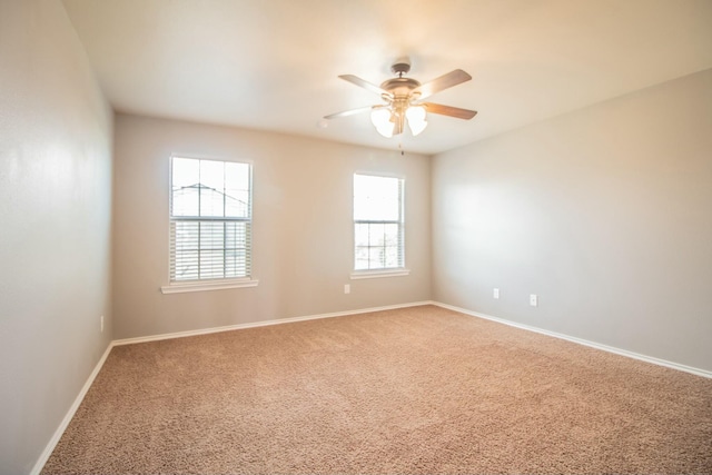 5728 109th St, Lubbock, TX 79424 - spare room with baseboards, carpet flooring, ceiling fan, and a healthy amount of sunlight