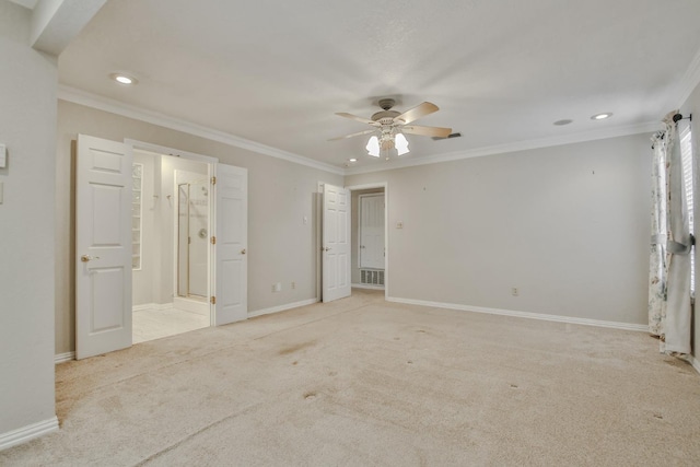 unfurnished bedroom with connected bathroom, crown molding, light colored carpet, and ceiling fan