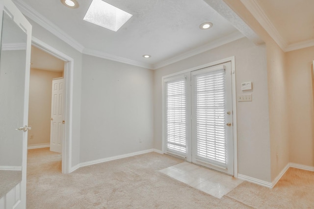 doorway to outside with light colored carpet, ornamental molding, and a skylight