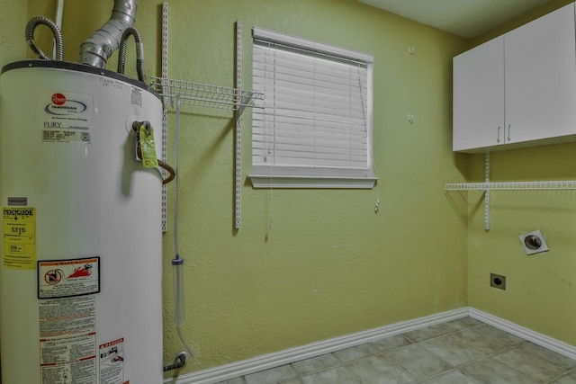 clothes washing area featuring light tile patterned flooring, cabinets, hookup for an electric dryer, and water heater