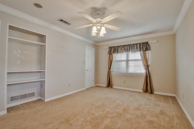 unfurnished bedroom featuring light carpet, ornamental molding, and ceiling fan