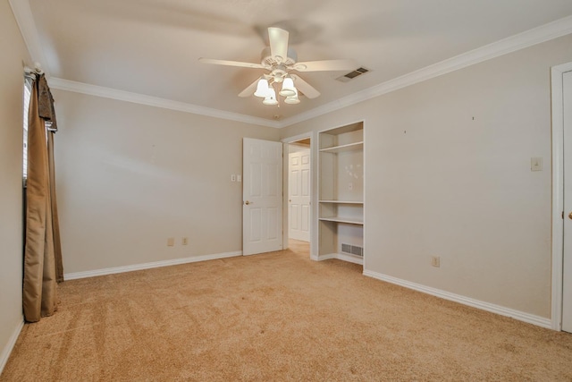 unfurnished bedroom featuring ornamental molding, light carpet, and ceiling fan