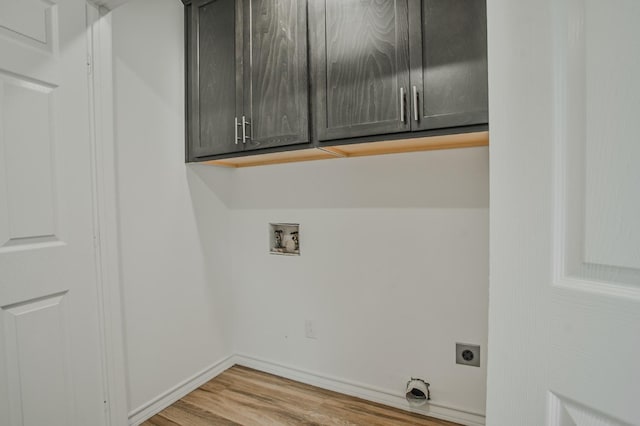 laundry room with cabinets, washer hookup, hookup for an electric dryer, and light hardwood / wood-style floors