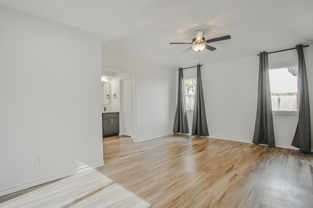 unfurnished room with ceiling fan and light wood-type flooring