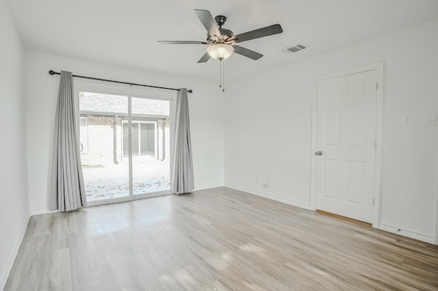 spare room with light hardwood / wood-style floors and ceiling fan