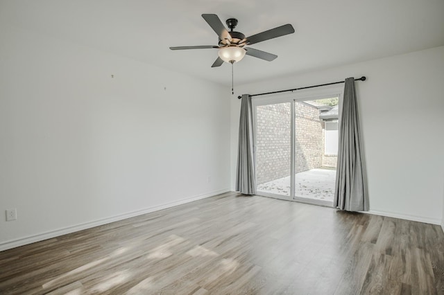 spare room featuring light hardwood / wood-style flooring and ceiling fan