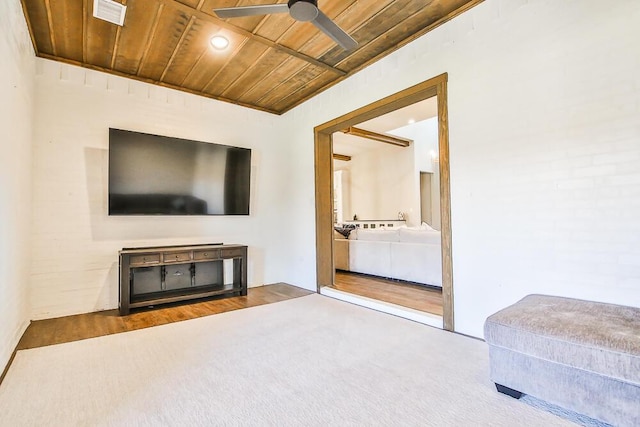 carpeted living area with a ceiling fan, wooden ceiling, and visible vents