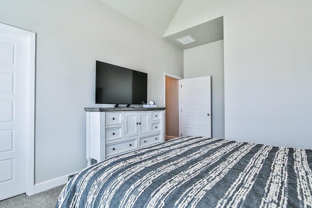 bedroom featuring vaulted ceiling, carpet flooring, visible vents, and baseboards