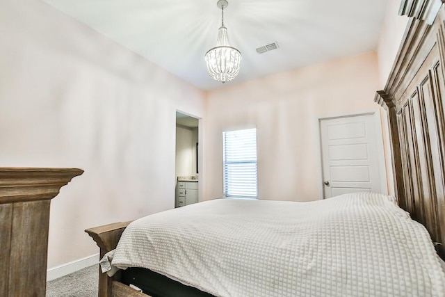 carpeted bedroom featuring a chandelier, visible vents, and baseboards