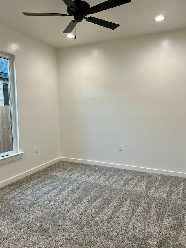 unfurnished room featuring carpet floors and ceiling fan