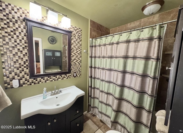 5442 14th St, Lubbock, TX 79416 - full bathroom with vanity, a shower with shower curtain, and tile patterned flooring