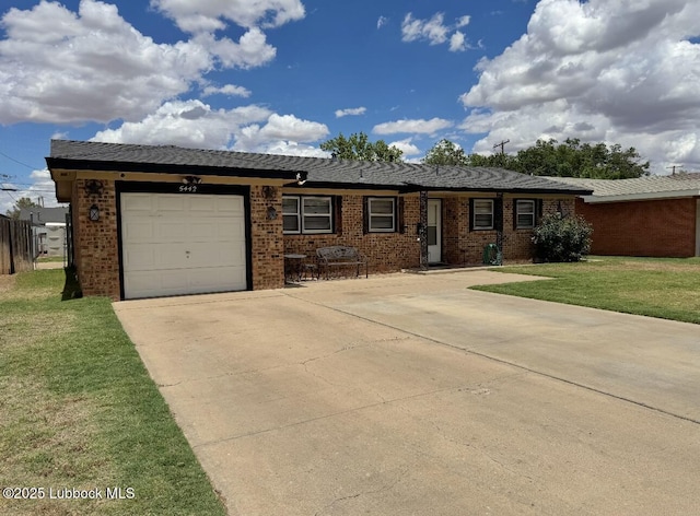 5442 14th St, Lubbock, TX 79416 - view of front facade featuring concrete driveway, brick siding, an attached garage, and a front yard