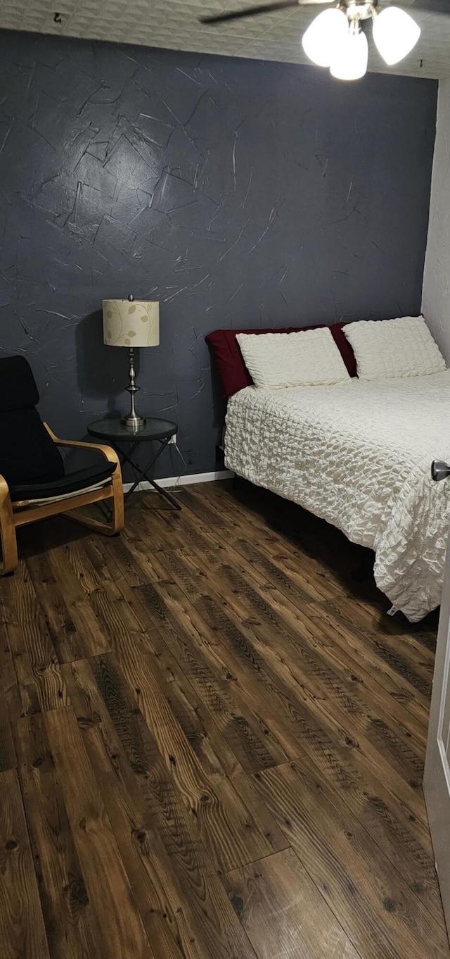 bedroom featuring wood finished floors