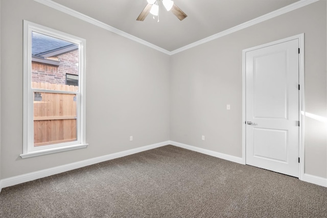 carpeted empty room featuring crown molding and ceiling fan