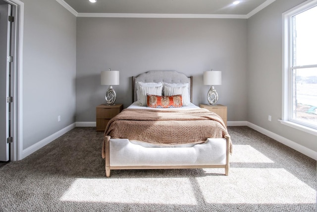 bedroom featuring multiple windows, ornamental molding, and carpet floors