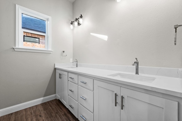 bathroom with vanity and wood-type flooring