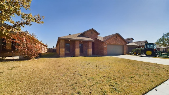 view of front of house featuring a garage and a front yard