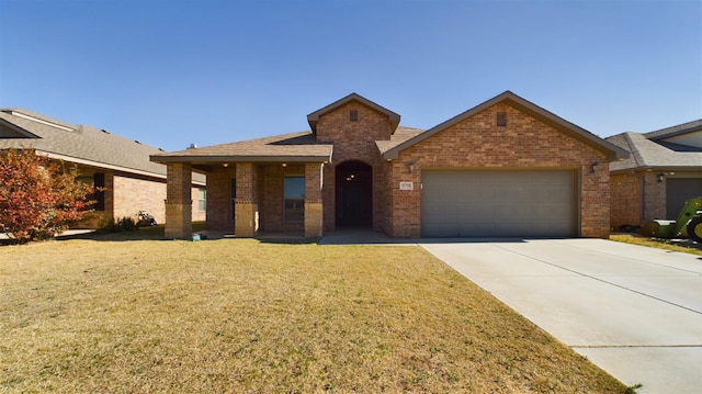 view of front facade featuring a garage and a front lawn