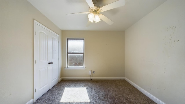 unfurnished bedroom featuring carpet floors, ceiling fan, and a closet