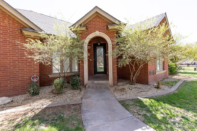 3709 156th St, Lubbock, TX 79423 - entrance to property with brick siding and a shingled roof