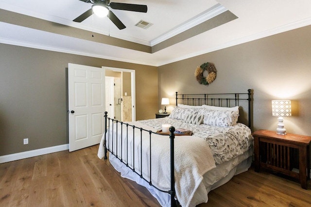 3709 156th St, Lubbock, TX 79423 - bedroom with wood finished floors, a raised ceiling, crown molding, and ceiling fan