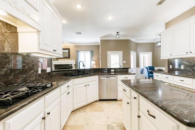 3709 156th St, Lubbock, TX 79423 - kitchen with stainless steel dishwasher, black gas stovetop, crown molding, recessed lighting, and tasteful backsplash