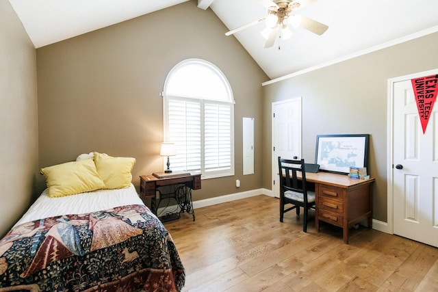 3709 156th St, Lubbock, TX 79423 - bedroom featuring light wood-style floors, vaulted ceiling, multiple windows, a desk, and a ceiling fan