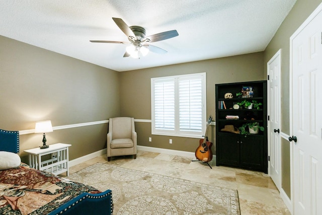 3709 156th St, Lubbock, TX 79423 - living area featuring ceiling fan and a textured ceiling
