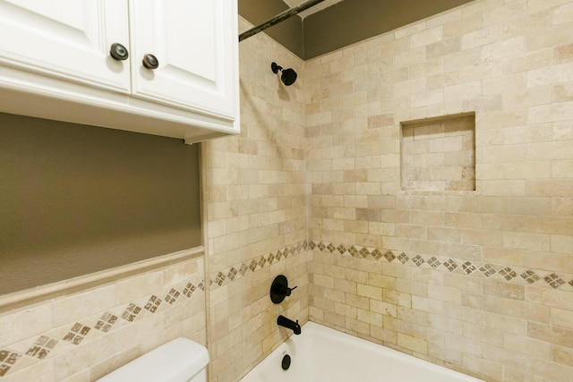 3709 156th St, Lubbock, TX 79423 - full bath with washtub / shower combination, tile walls, and a wainscoted wall