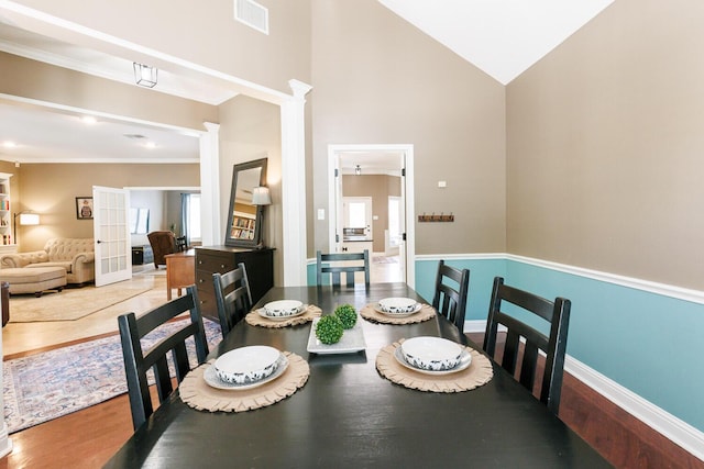 3709 156th St, Lubbock, TX 79423 - dining space with vaulted ceiling, wood finished floors, and crown molding