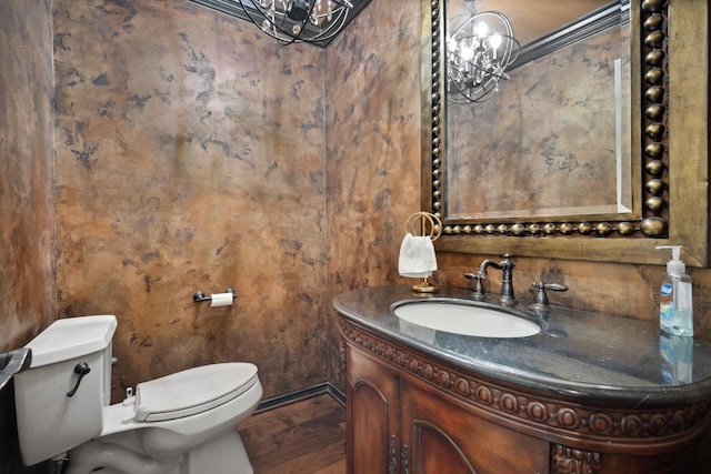 bathroom with vanity, hardwood / wood-style flooring, and toilet