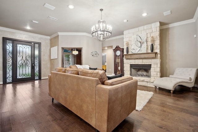 living room featuring crown molding, dark hardwood / wood-style flooring, and a stone fireplace