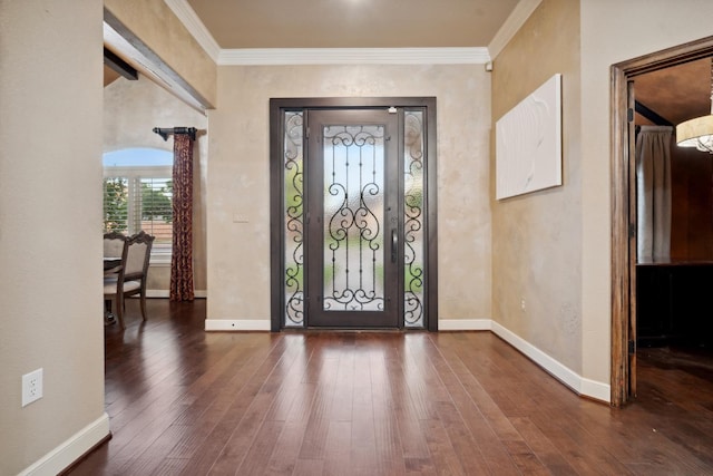 entrance foyer with crown molding and wood-type flooring