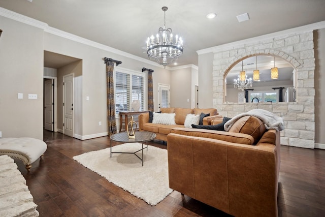 living room with an inviting chandelier, dark hardwood / wood-style floors, and crown molding