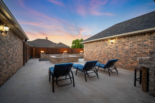 view of patio terrace at dusk