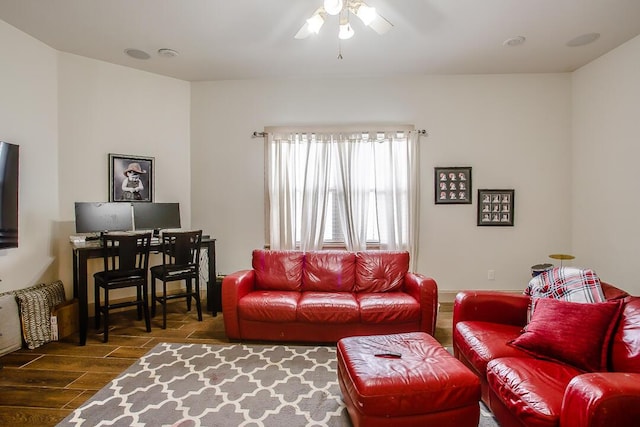 living area featuring wood finish floors and a ceiling fan
