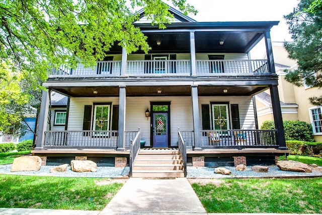 view of front facade featuring a porch and a balcony