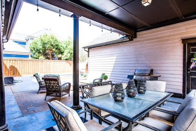 view of patio / terrace featuring outdoor dining space, fence private yard, and grilling area