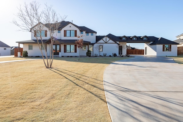 view of front of property with a front yard and fence