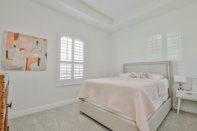 carpeted bedroom with baseboards