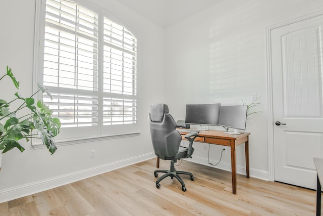 office with baseboards and wood finished floors