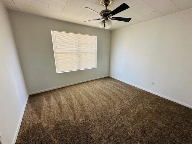 empty room featuring ceiling fan and carpet floors