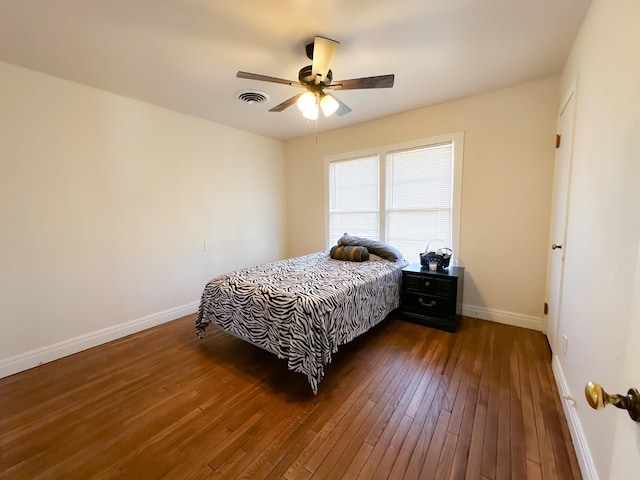 bedroom featuring ceiling fan and dark hardwood / wood-style floors