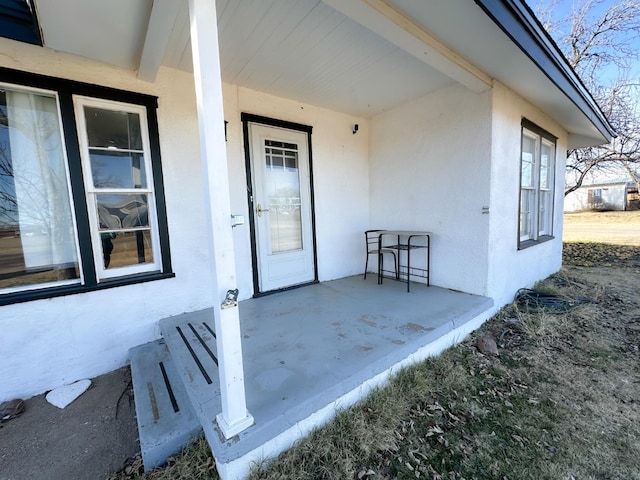 property entrance featuring a patio area